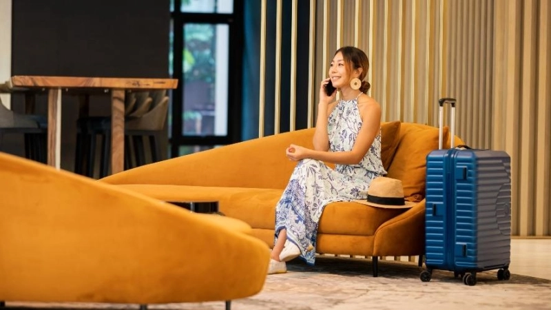 A woman sitting in a lobby