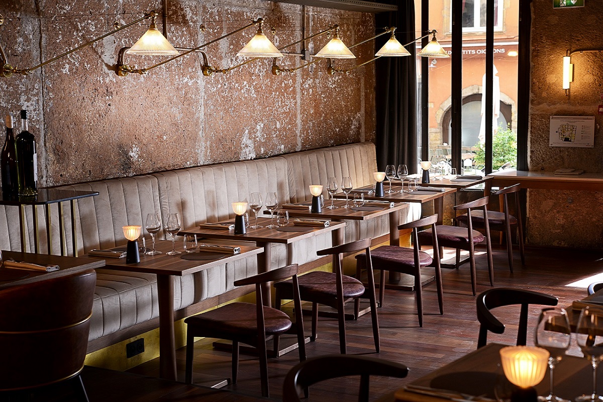 distressed plaster walls and leather seating Cour des Loges Lyon, A Radisson Collection Hotel_Comptoir