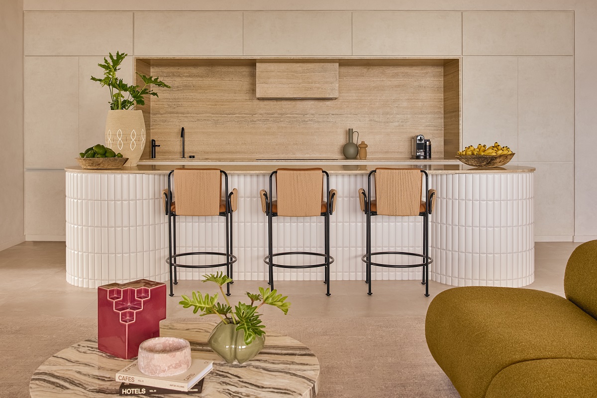 stone coffee table in front of tiled bar and wooden panelled wall - Mondrian Gold Coast