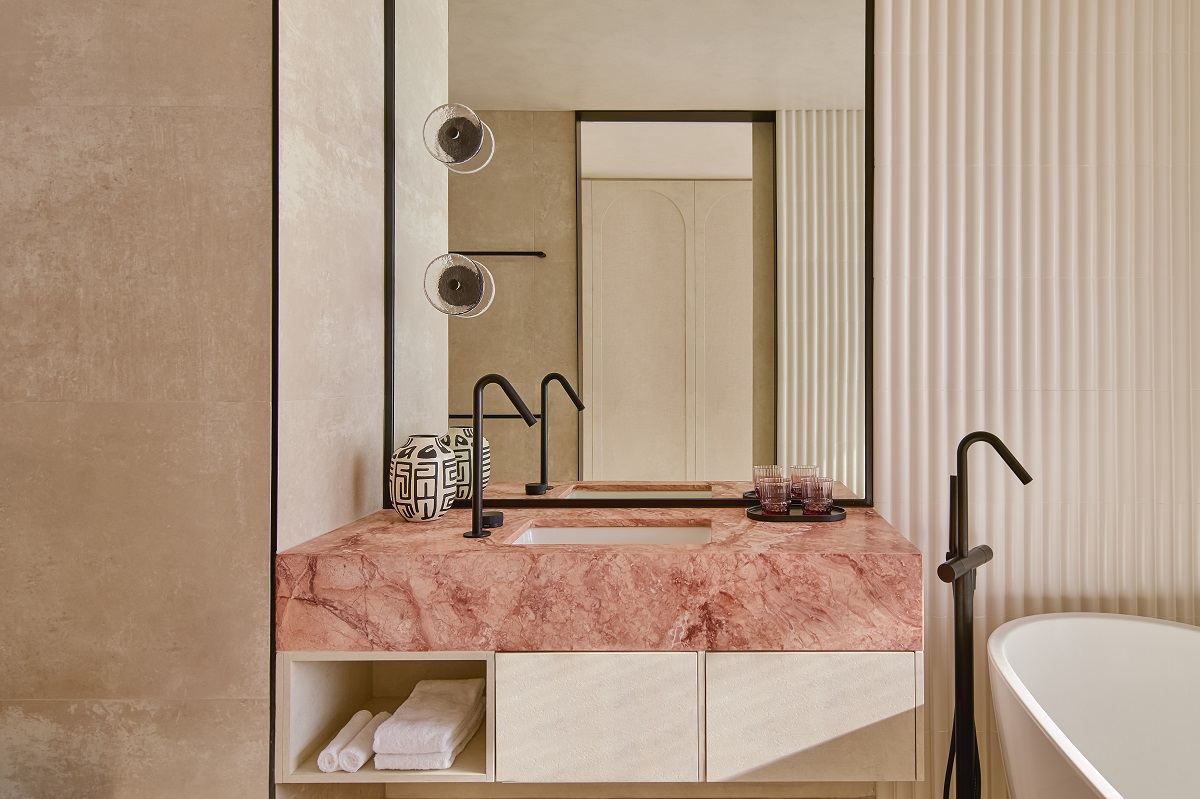 pink marble vanity and textured stone in bathroom Mondrian Gold Coast
