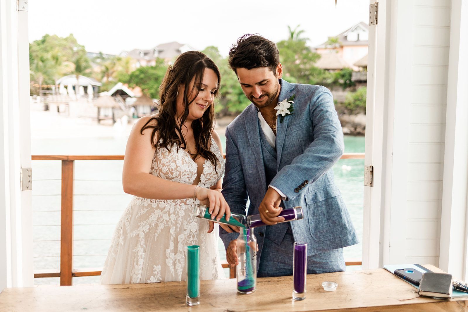 conor and kirsten taking part in the sand ceremony at sandals ochi