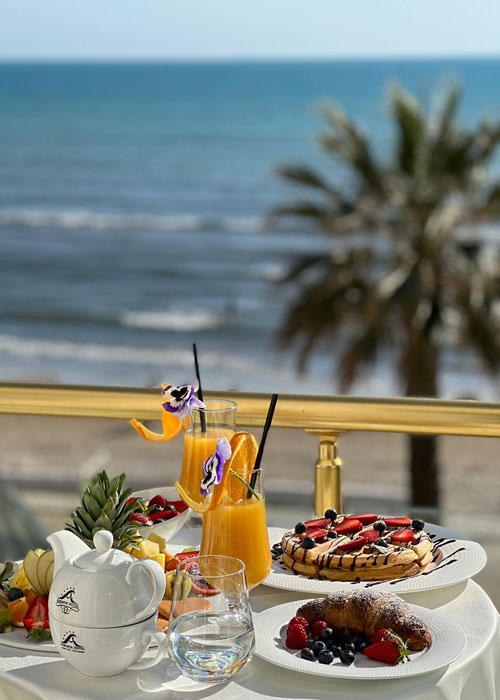 Breakfast on the terrace overlooking the ocean at Adriatik Hotel in Durres, Albania.