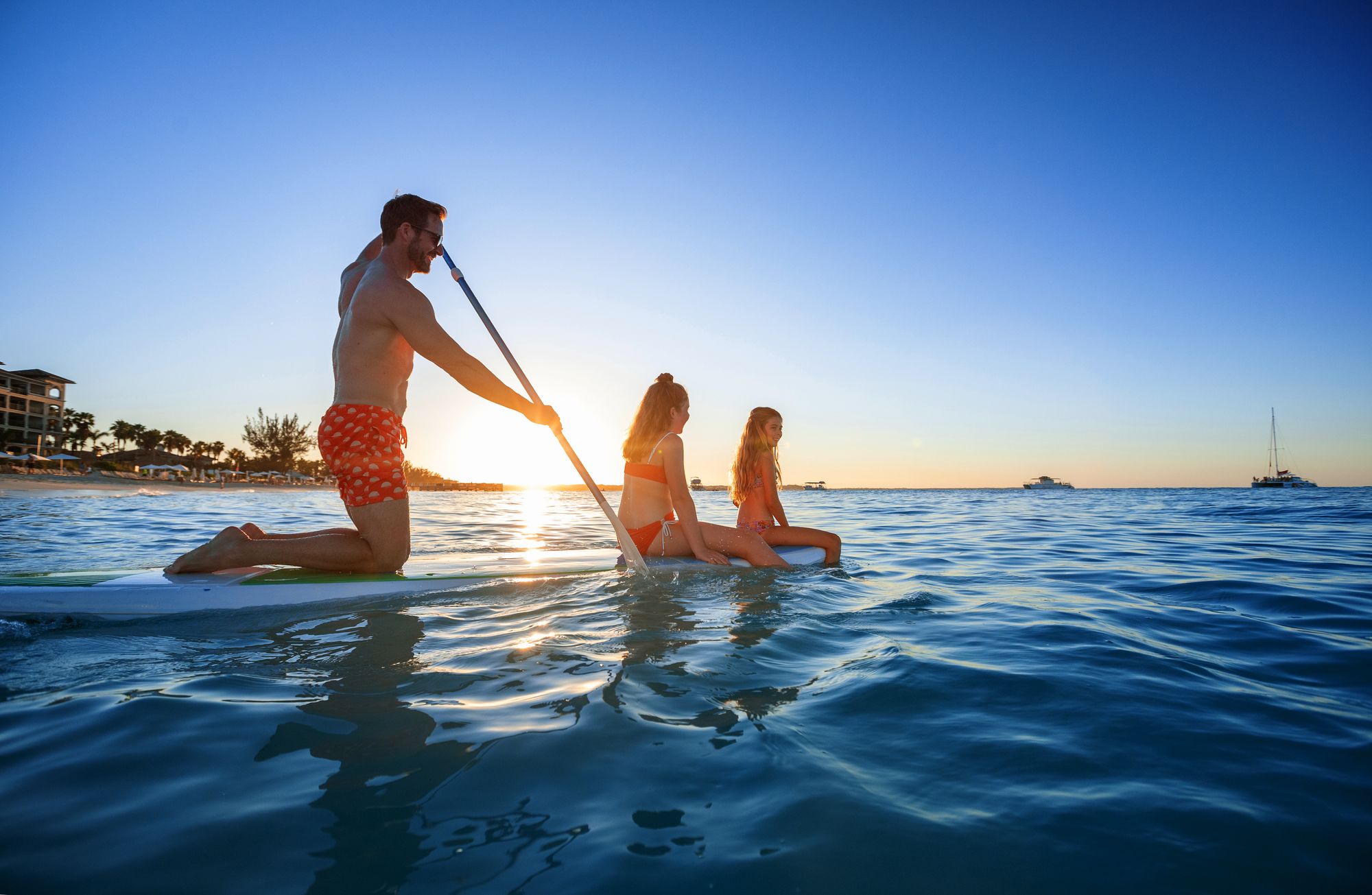 family paddle boarding